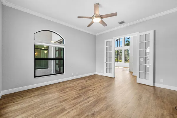 a bathroom with a granite countertop sink a toilet and a mirror