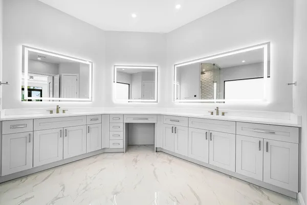 a white bath tub sitting next to a white sink