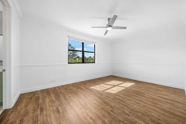 a view of a building with a tub and potted plants