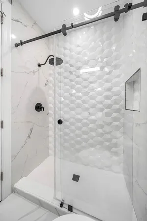 a view of a livingroom with furniture and natural light