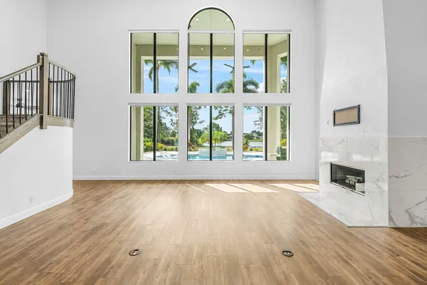a view of an entryway with wooden floor