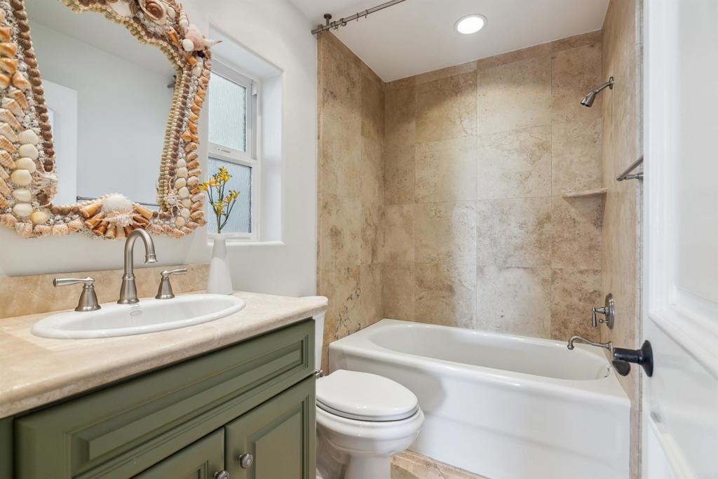 848 Prospect Street, Unit D La Jolla, CA 92037 - Photo 14 of 17 a bathroom with a sink a toilet and a bathtub