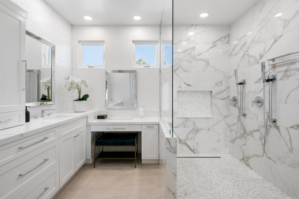 848 Prospect Street, Unit D La Jolla, CA 92037 - Photo 3 of 17 a spacious bathroom with a double sink shower and a mirror