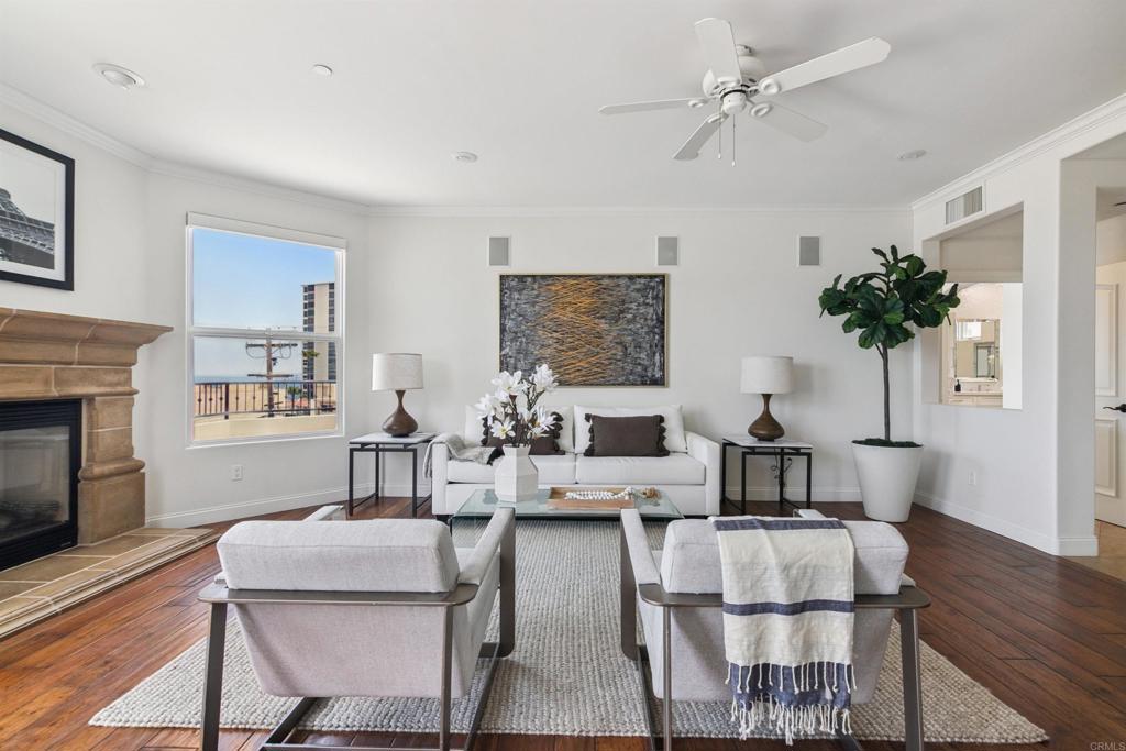848 Prospect Street, Unit D La Jolla, CA 92037 - Photo 7 of 17 a living room with furniture and a fireplace