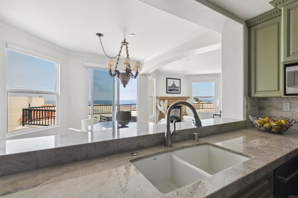 848 Prospect Street, Unit D La Jolla, CA 92037 - Photo 8 of 17 a kitchen with a sink and a counter top space
