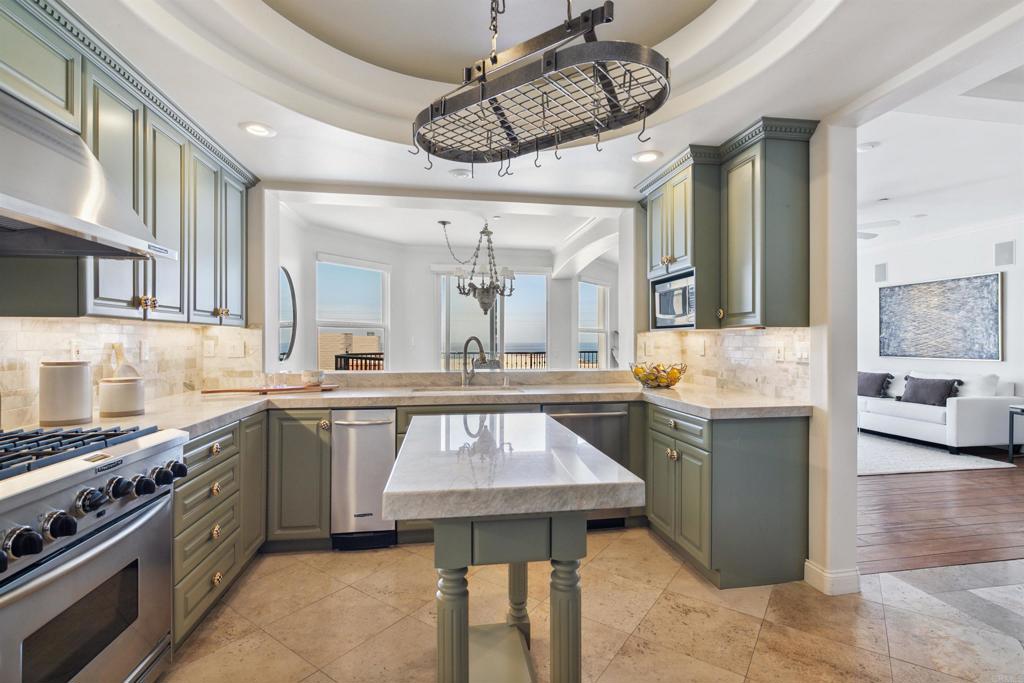 848 Prospect Street, Unit D La Jolla, CA 92037 - Photo 9 of 17 a kitchen with a table and chairs in it