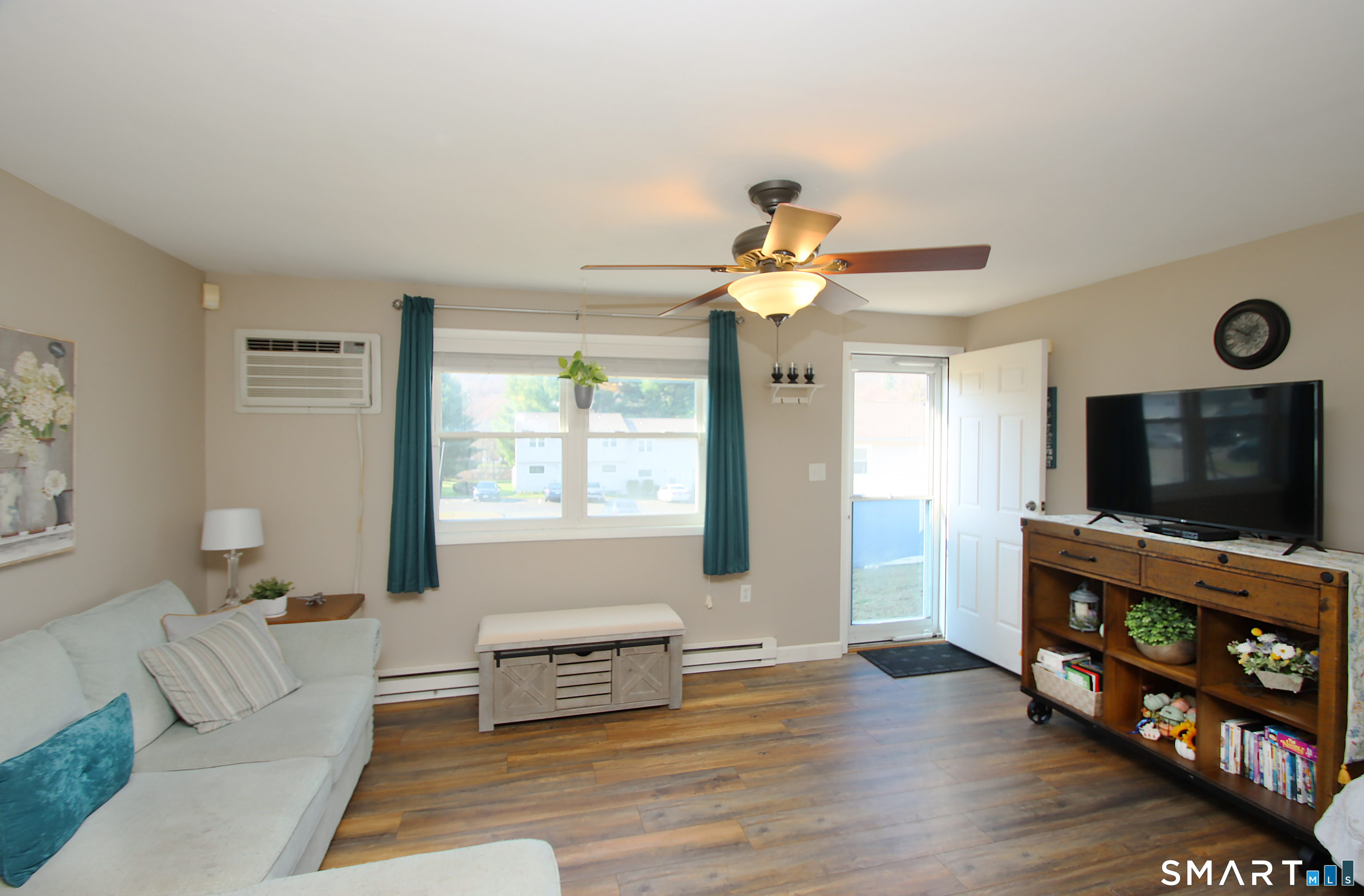 a living room with furniture and a flat screen tv