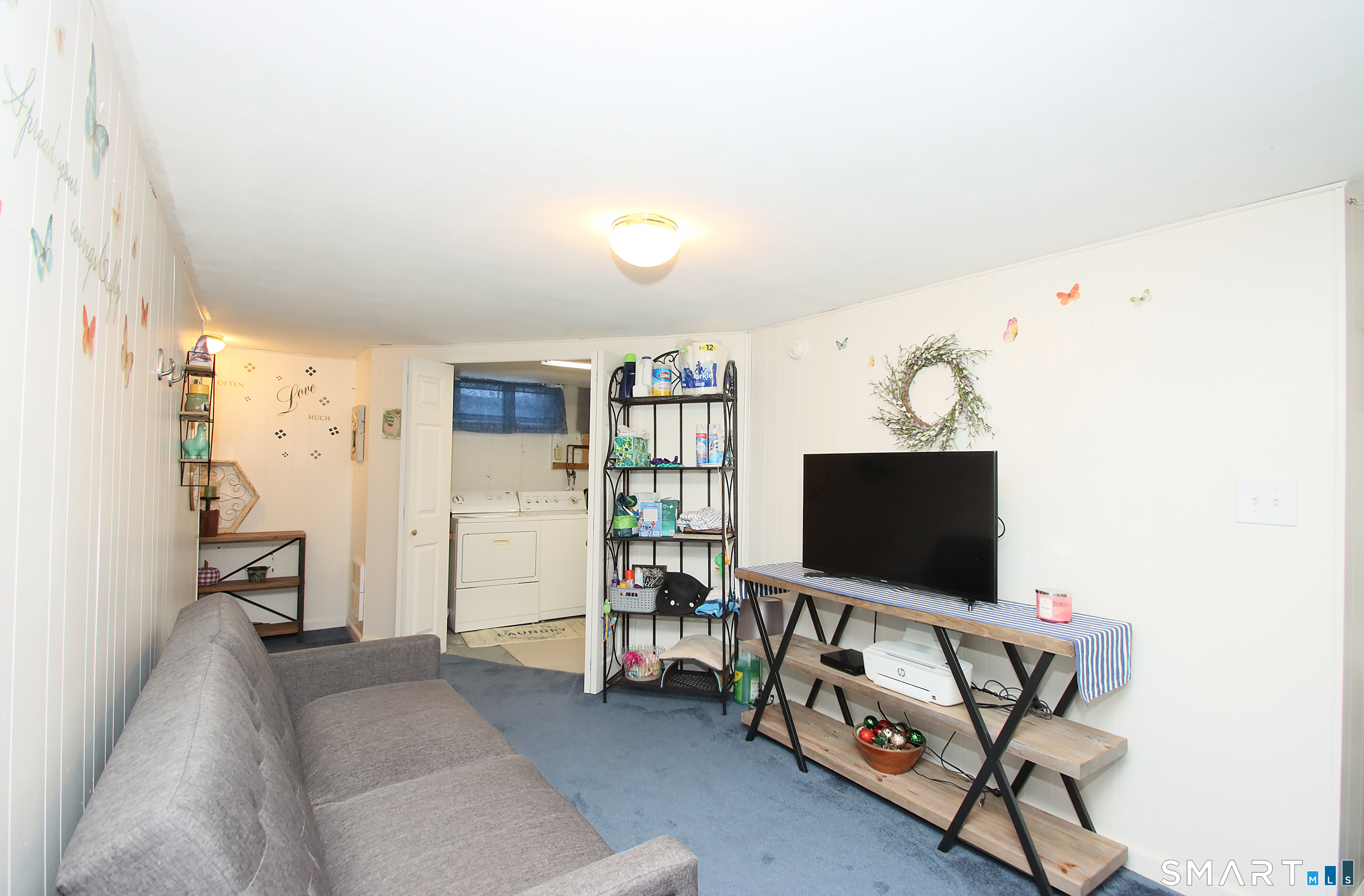 1081 New Haven Road, Unit 10C Naugatuck, CT 06770 - Photo 12 of 16 a living room with furniture and a flat screen tv