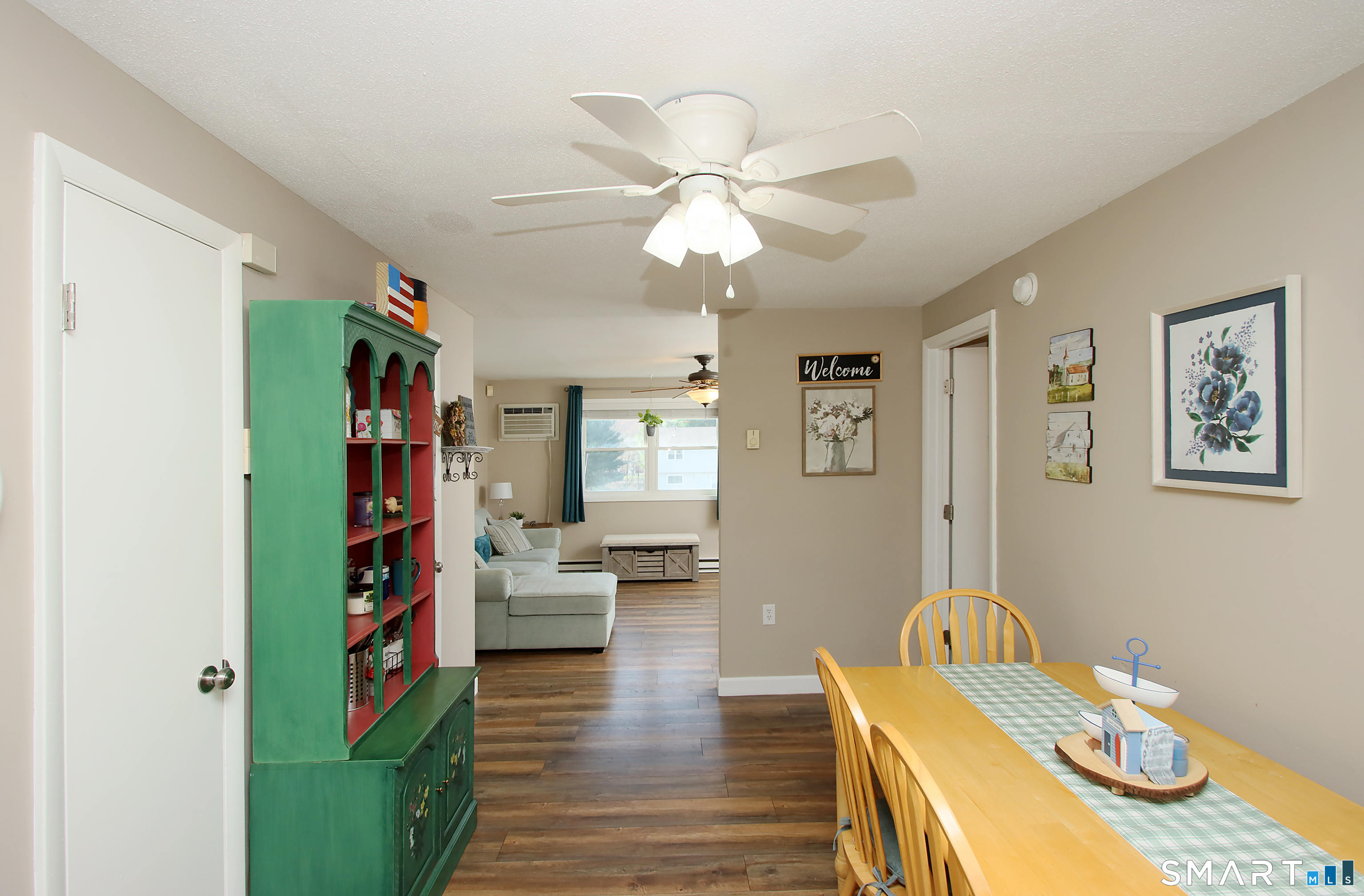 1081 New Haven Road, Unit 10C Naugatuck, CT 06770 - Photo 5 of 16 a living room with furniture and a book shelf