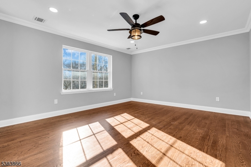2000 Whittier Street Rahway, NJ 07065 - Photo 20 of 32 a view of a big room with wooden floor and windows