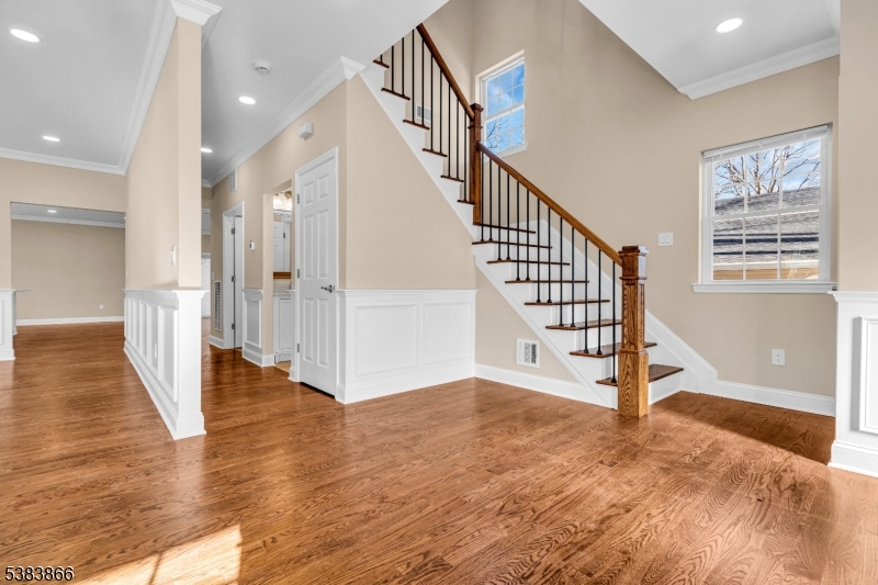 2000 Whittier Street Rahway, NJ 07065 - Photo 6 of 32 a view of a hallway with wooden floor and staircase