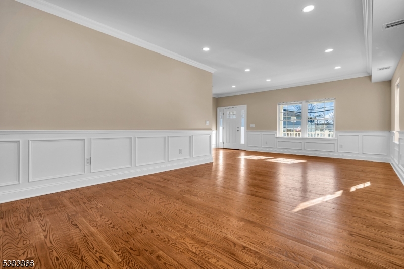 2000 Whittier Street Rahway, NJ 07065 - Photo 9 of 32 a view of an empty room with wooden floor and a window