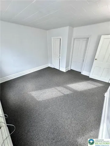 a view of empty room with windows