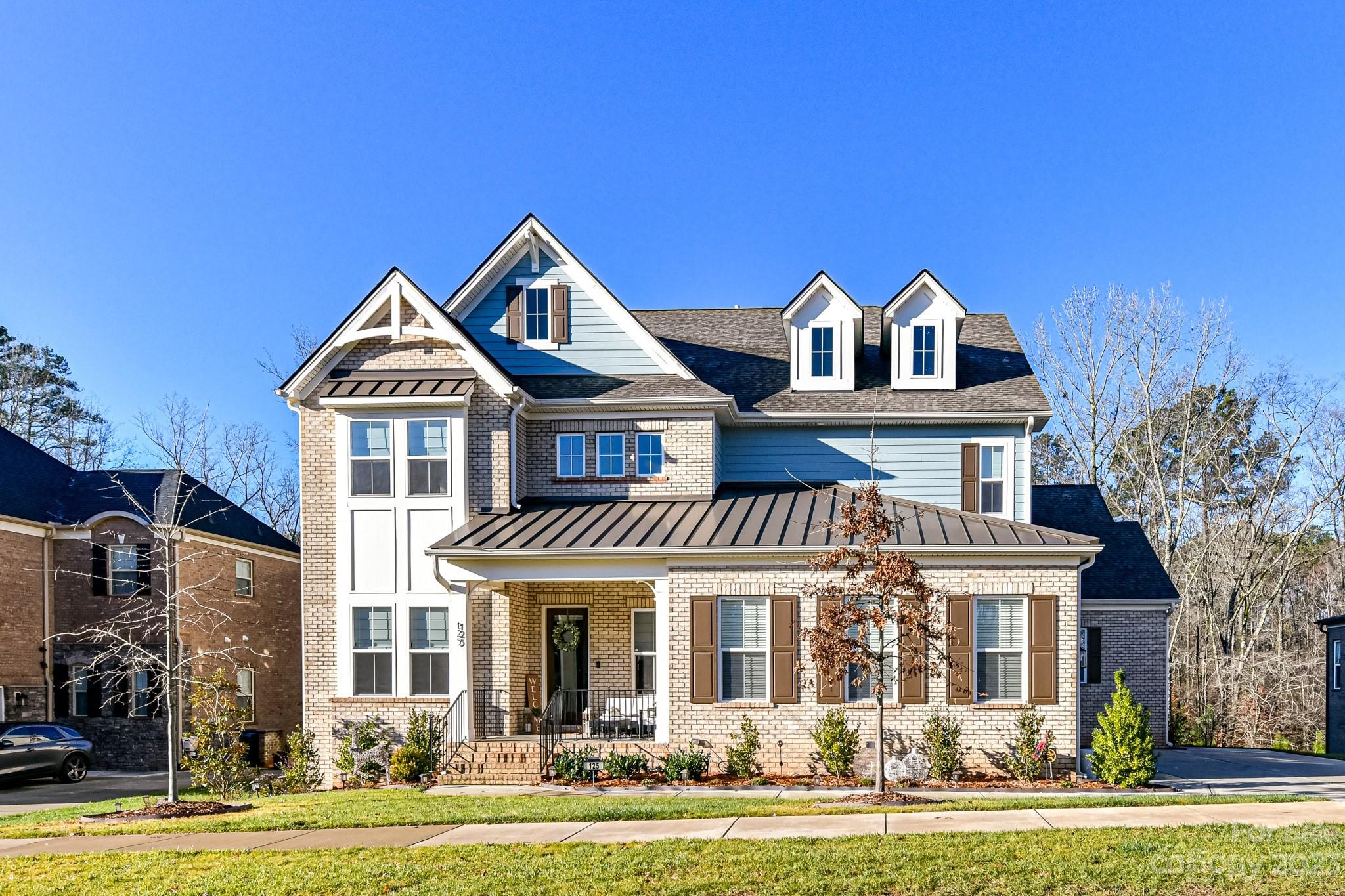 a front view of a house with a yard