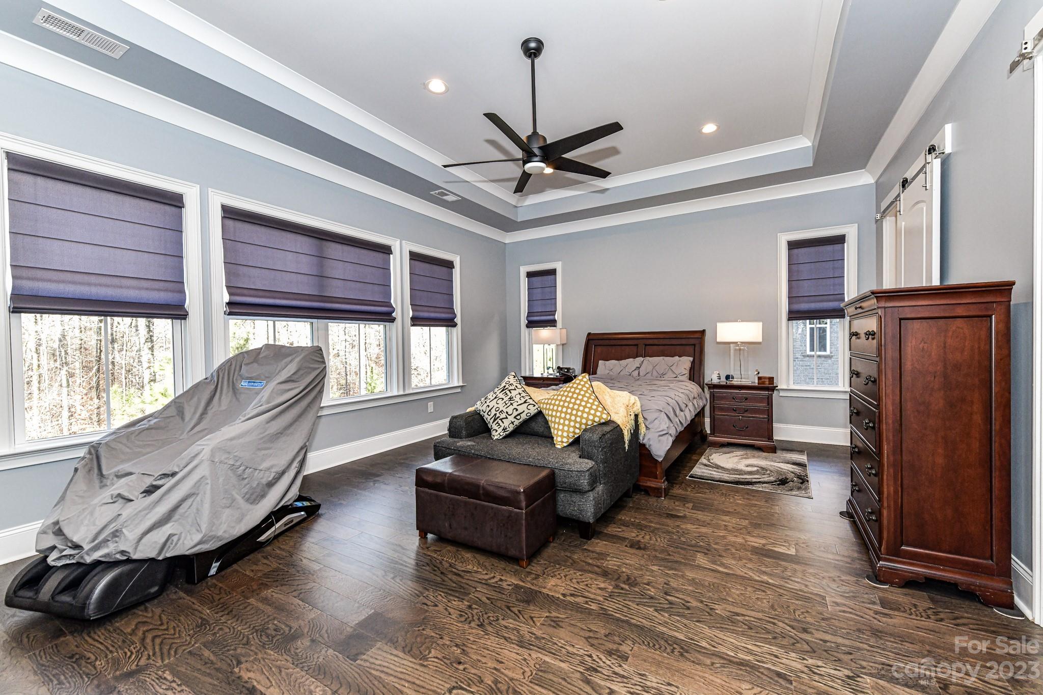 125 Turtleback Ridge, Unit 122 Matthews, NC 28104 - Photo 15 of 40 a living room with furniture window and a ceiling fan