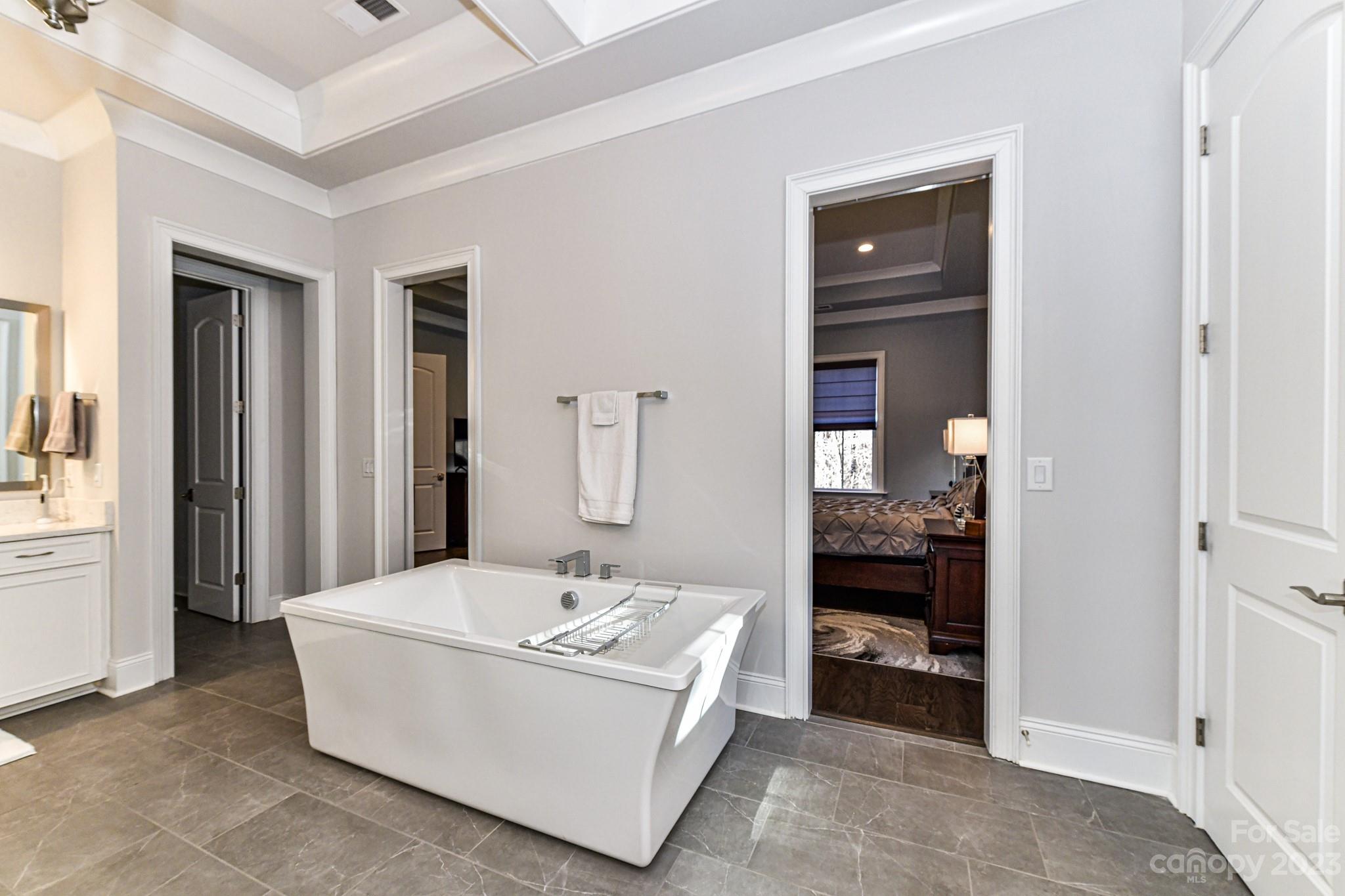 125 Turtleback Ridge, Unit 122 Matthews, NC 28104 - Photo 17 of 40 a bathroom with a sink and a mirror
