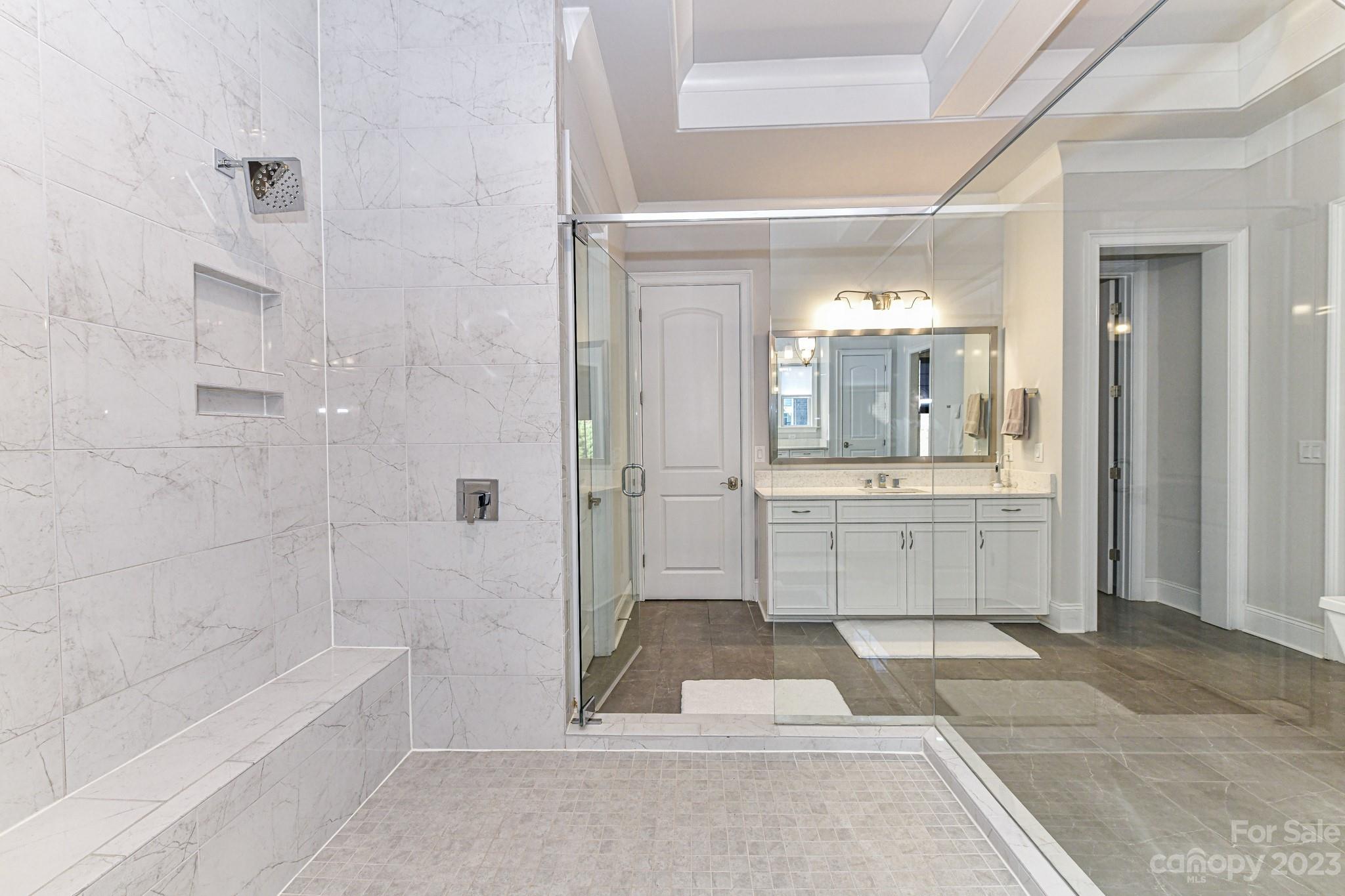 125 Turtleback Ridge, Unit 122 Matthews, NC 28104 - Photo 18 of 40 a bathroom with a tub shower and sink