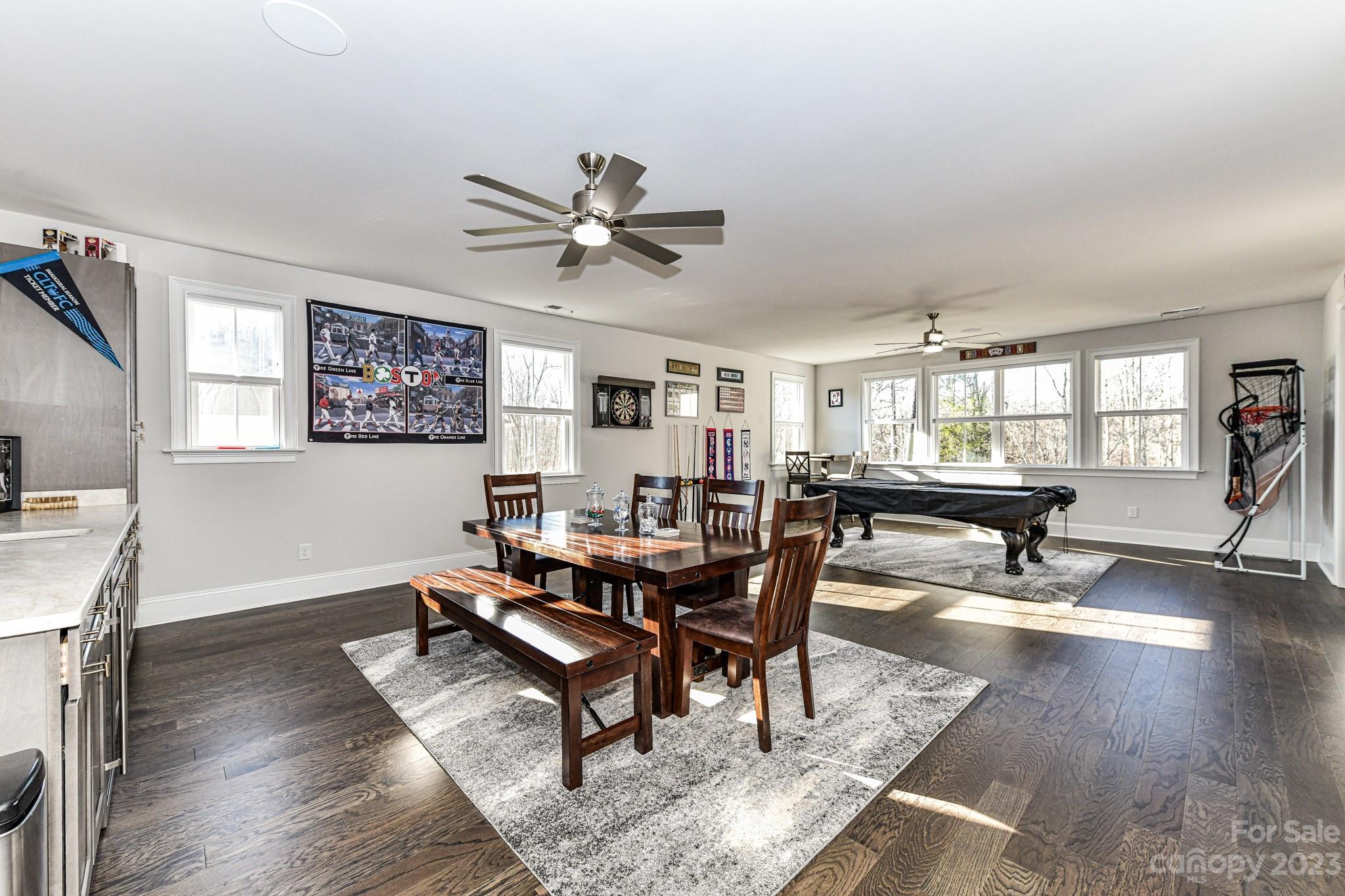 125 Turtleback Ridge, Unit 122 Matthews, NC 28104 - Photo 26 of 40 a living room with furniture and a wooden floor