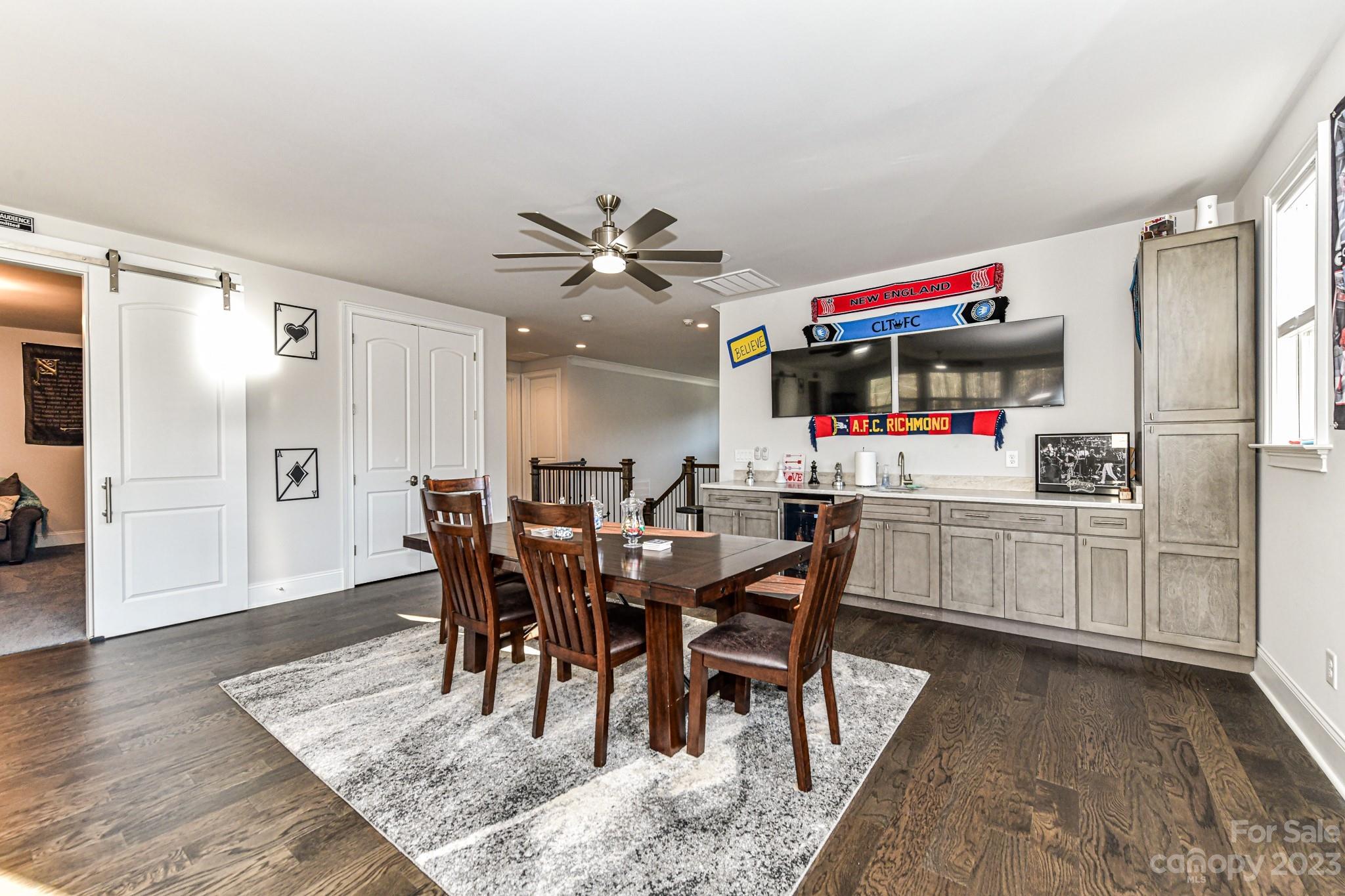 125 Turtleback Ridge, Unit 122 Matthews, NC 28104 - Photo 27 of 40 a view of a dining room with furniture and wooden floor