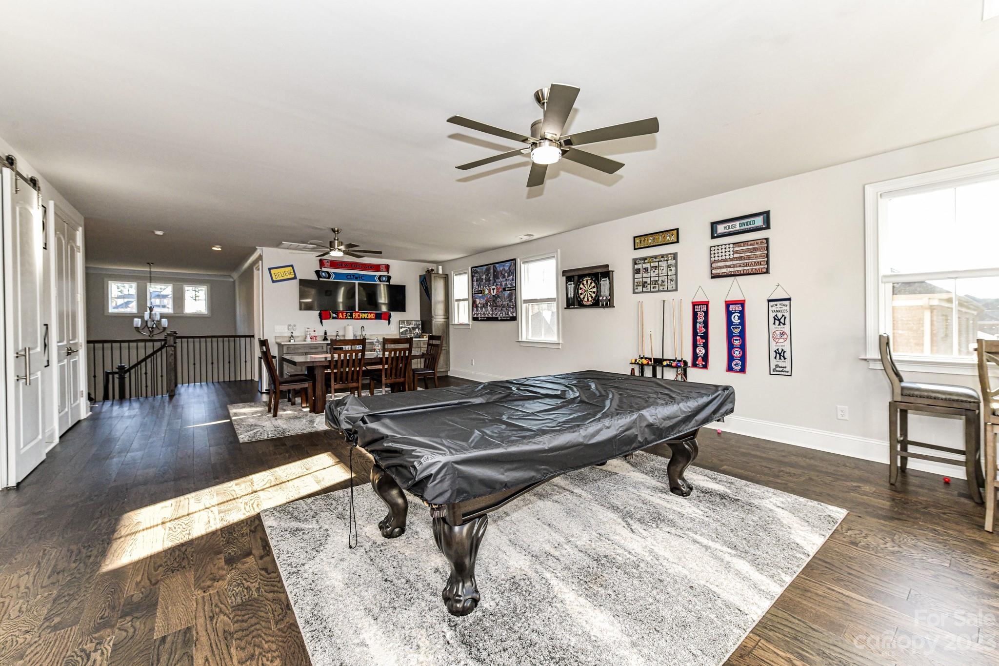125 Turtleback Ridge, Unit 122 Matthews, NC 28104 - Photo 29 of 40 a living room with furniture pool table and a window
