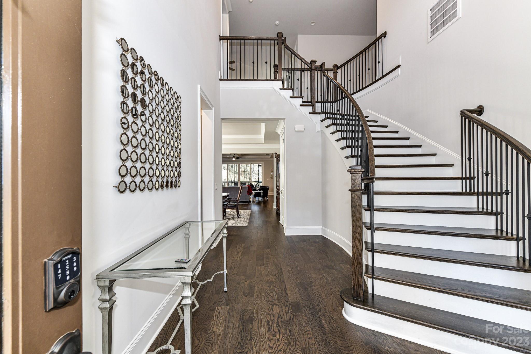 125 Turtleback Ridge, Unit 122 Matthews, NC 28104 - Photo 3 of 40 a view of entryway and hall with wooden floor
