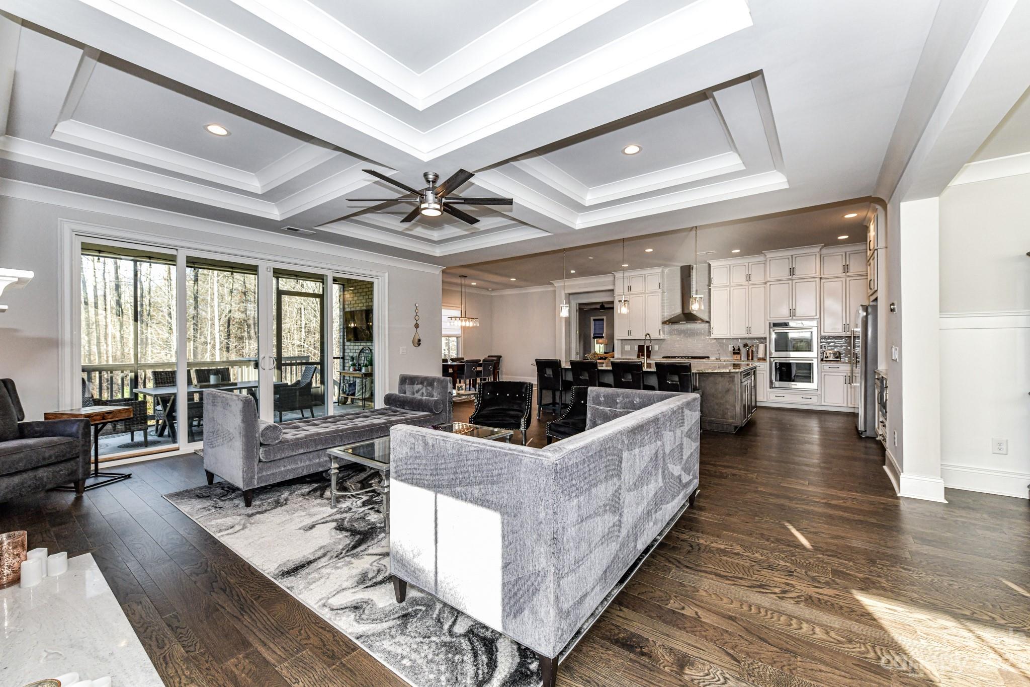 125 Turtleback Ridge, Unit 122 Matthews, NC 28104 - Photo 8 of 40 a large living room with stainless steel appliances furniture and a large window