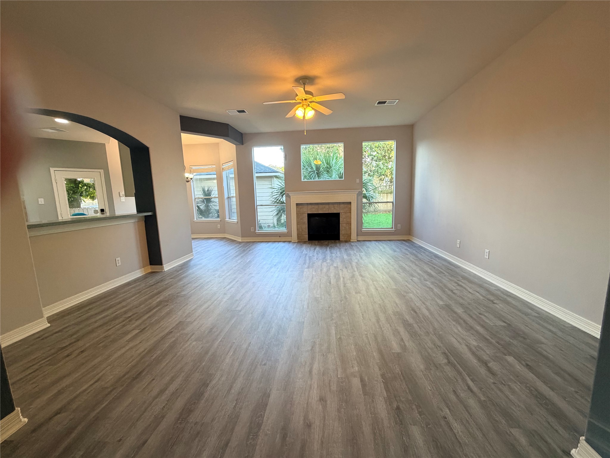 2303 Chelsea Ridge Court Katy, TX 77450 - Photo 7 of 12 wooden floor in an empty room with a window