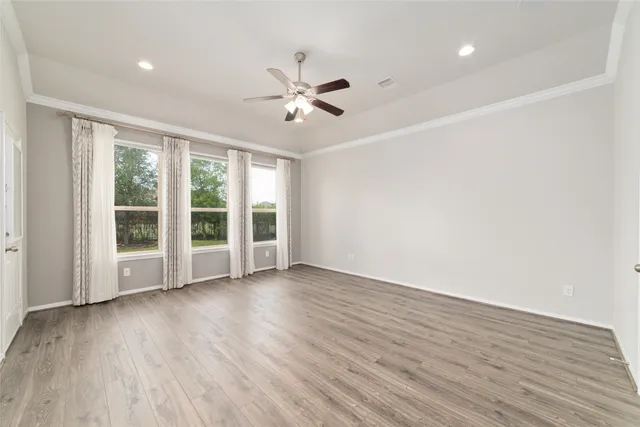 a large spacious bathroom with a granite countertop tub a double vanity sink and a shower
