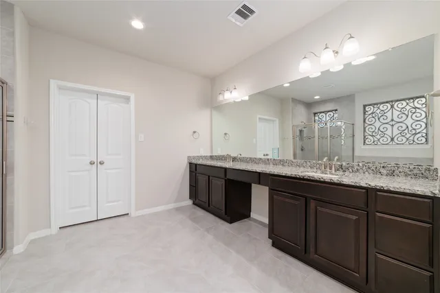 a bathroom with a bathtub and shower