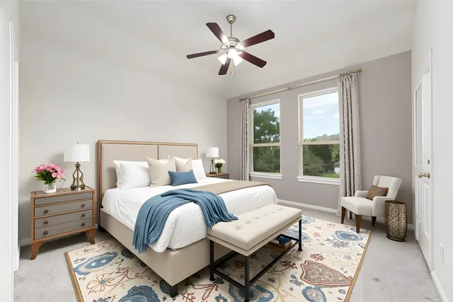 a bathroom with a granite countertop sink a mirror and a toilet