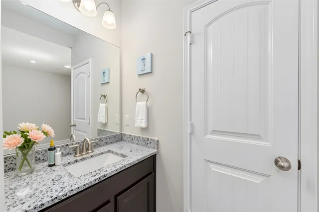 a spacious bedroom with a bed and a window