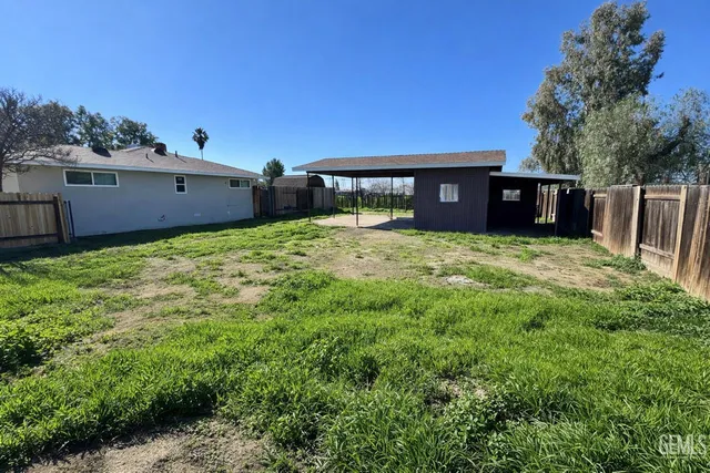 a backyard of a house with lots of green space