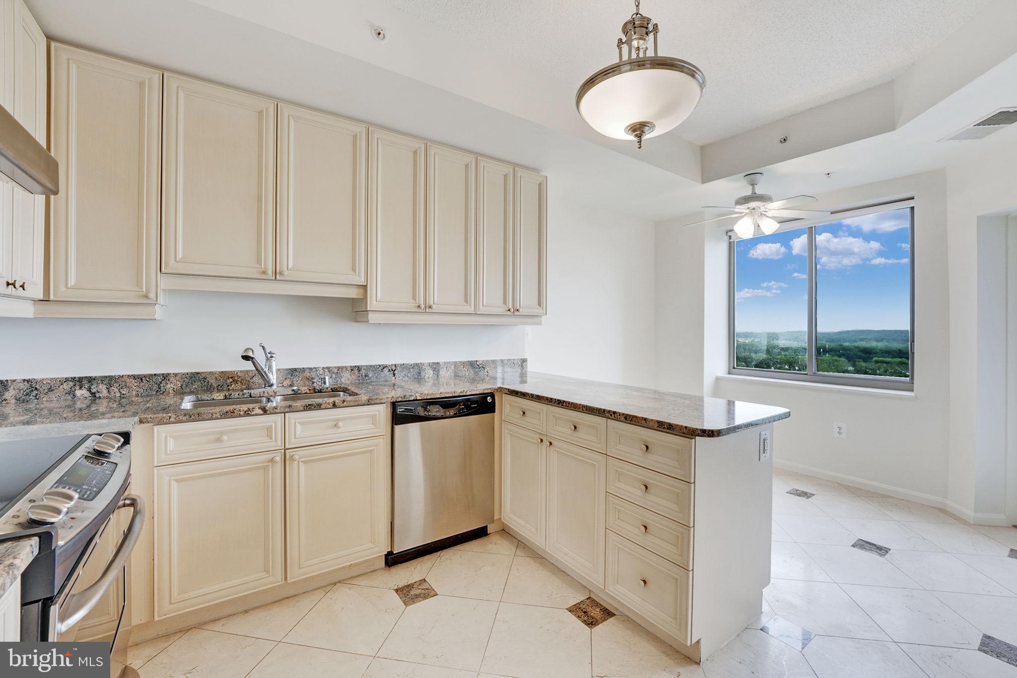 19355 Cypress Ridge Terrace, Unit 1111 Leesburg, VA 20176 - Photo 16 of 47 Marble tile kitchen with granite counters