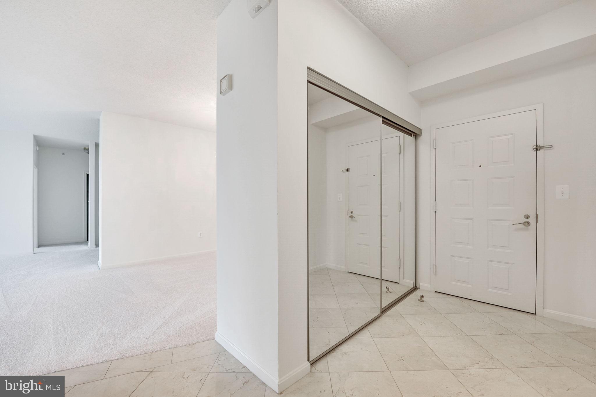 19355 Cypress Ridge Terrace, Unit 1111 Leesburg, VA 20176 - Photo 6 of 47 Unit entry with beautiful marble tile