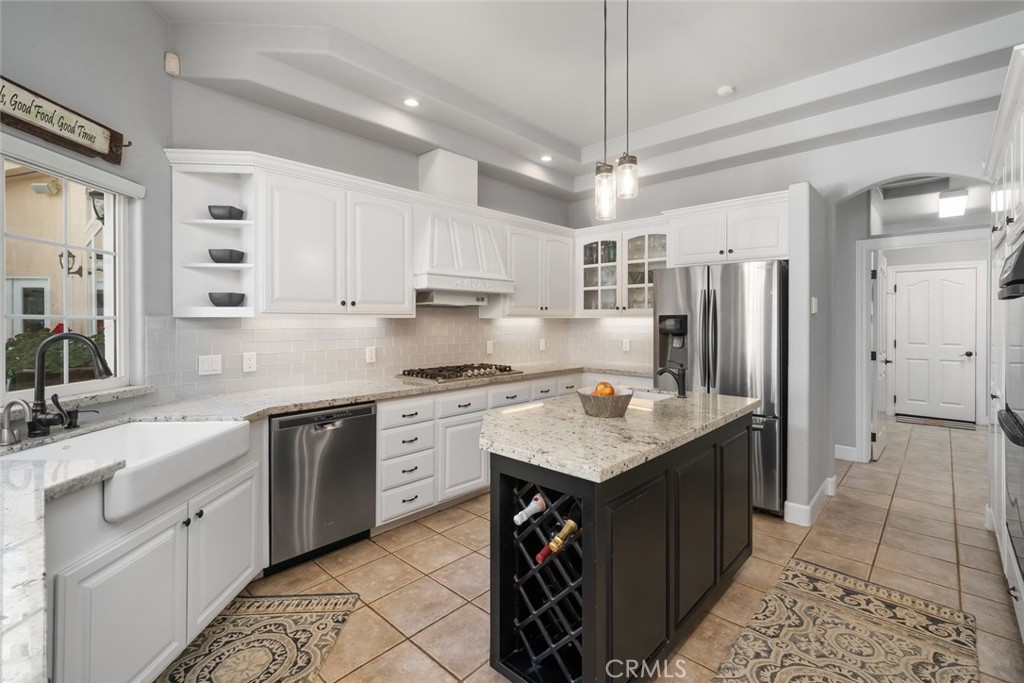 155 Conover Lane Templeton, CA 93465 - Photo 21 of 75 a kitchen with kitchen island granite countertop a sink a counter top space stainless steel appliances and cabinets