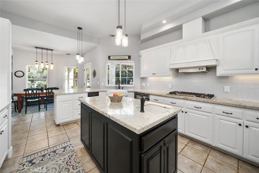 155 Conover Lane Templeton, CA 93465 - Photo 24 of 75 a kitchen with a sink dishwasher a stove a dining table and chairs with kitchen view