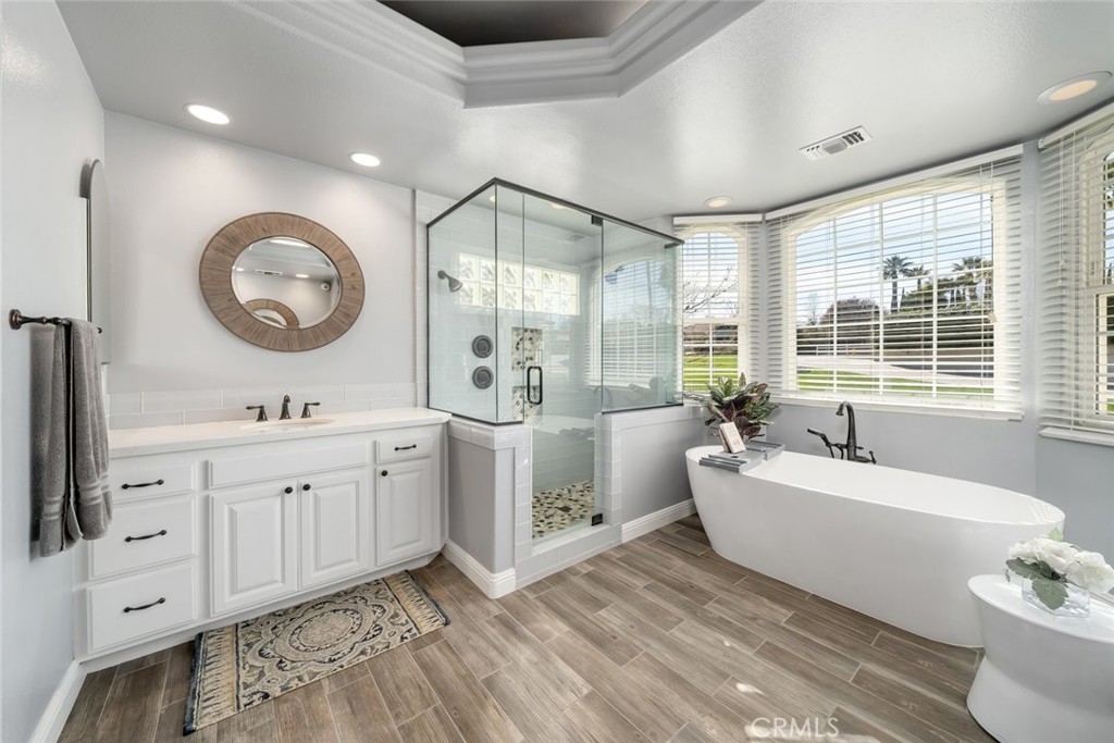 155 Conover Lane Templeton, CA 93465 - Photo 31 of 75 a spacious bathroom with a double vanity sink a mirror and a bathtub