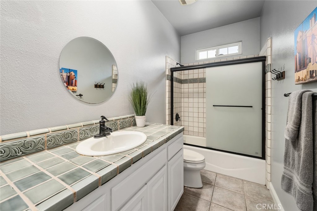 155 Conover Lane Templeton, CA 93465 - Photo 35 of 75 a bathroom with a sink a toilet and a mirror