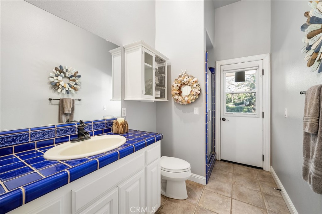 155 Conover Lane Templeton, CA 93465 - Photo 38 of 75 a bathroom with a sink a toilet and mirror