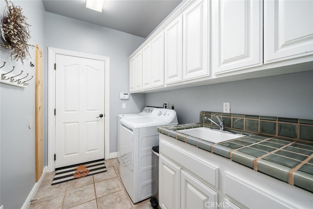155 Conover Lane Templeton, CA 93465 - Photo 40 of 75 a kitchen with a sink and cabinets