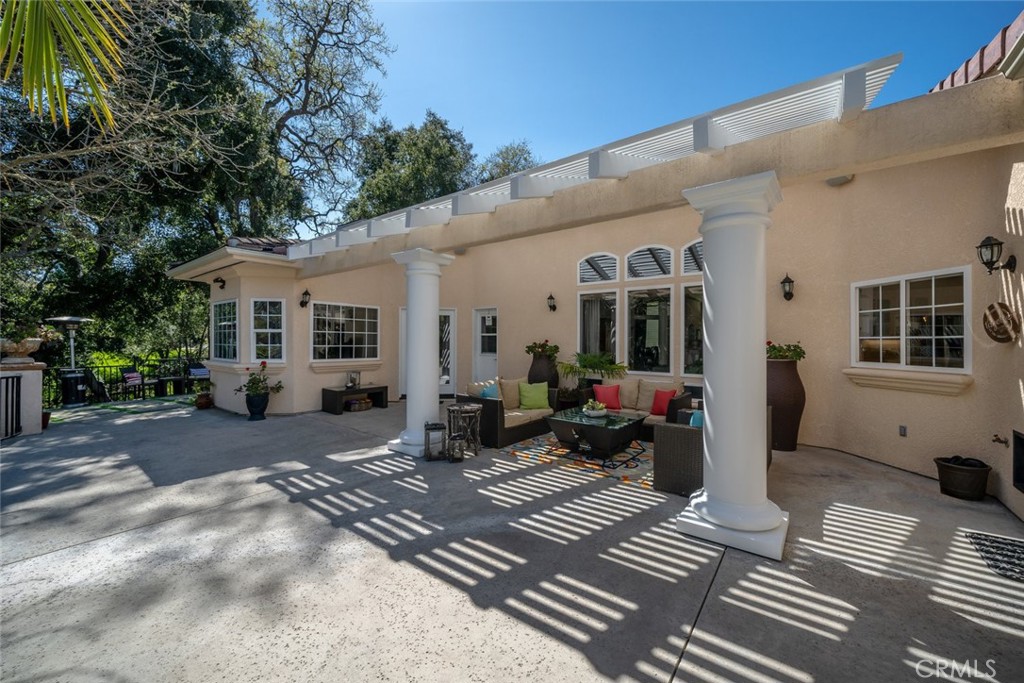 155 Conover Lane Templeton, CA 93465 - Photo 44 of 75 a view of a patio with table and chairs and potted plants