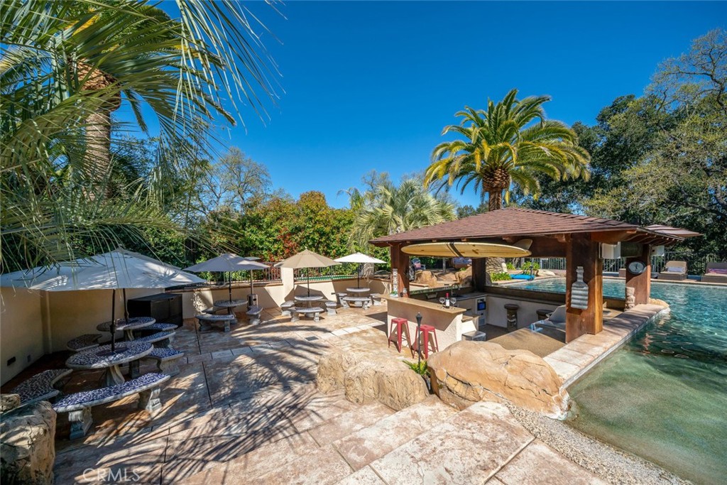 155 Conover Lane Templeton, CA 93465 - Photo 63 of 75 a view of a patio with table and chairs under an umbrella