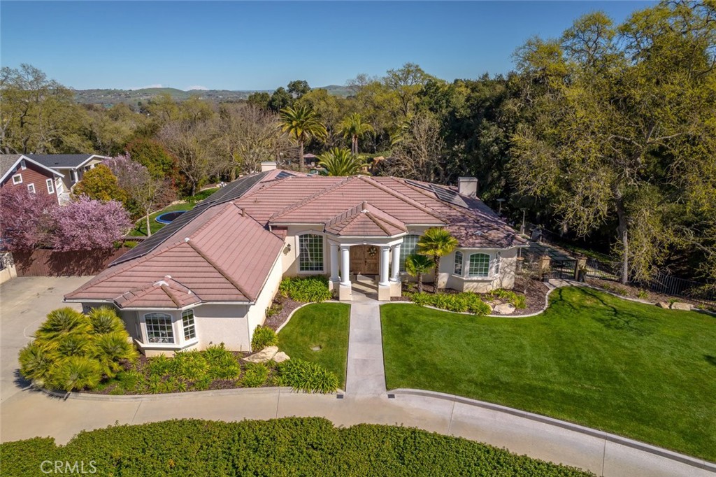 155 Conover Lane Templeton, CA 93465 - Photo 7 of 75 a view of a white house with a big yard plants and large trees