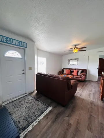 a bathroom with a sink a toilet a mirror and shower