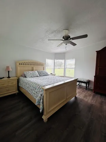 a bathroom with a toilet sink and shower