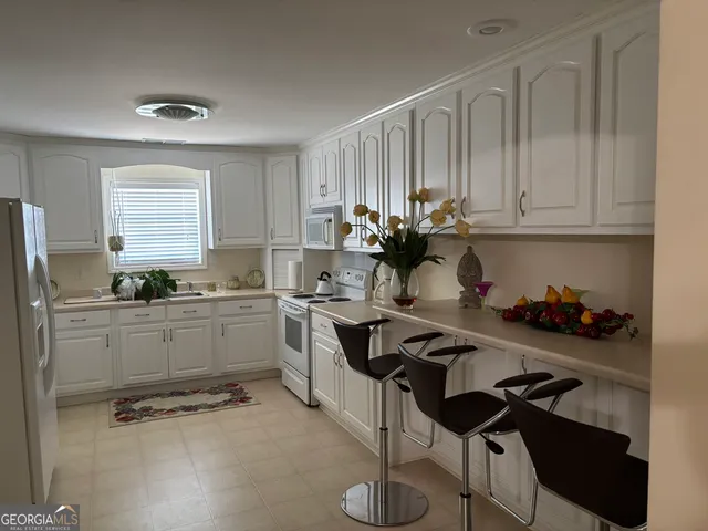 a bedroom with a bed and a lamp