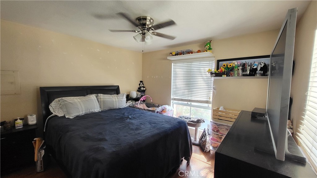 15000 Downey Avenue, Unit 249 Paramount, CA 90723 - Photo 11 of 11 a bedroom with a bed and a walk in closet