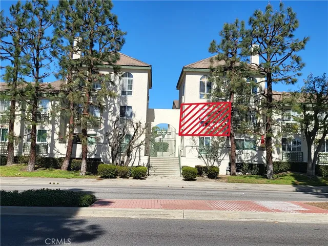 a view of a building with a street sign
