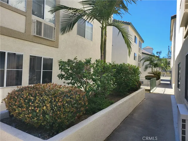 a view of a house with a flower garden