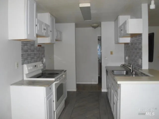 a bathroom with a toilet and a mirror